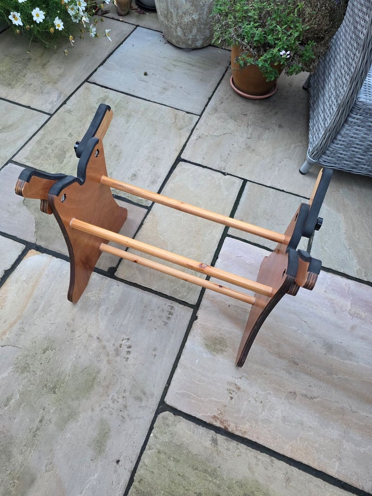 Model boat stand with adjustable supports.
