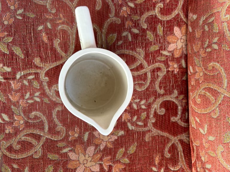 Ceramic milk jug with cow illustration