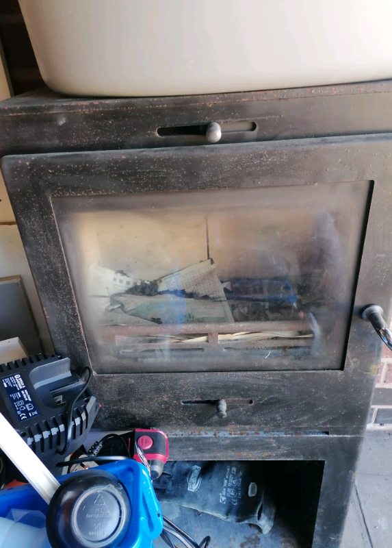 Wood log burner with storage underneath