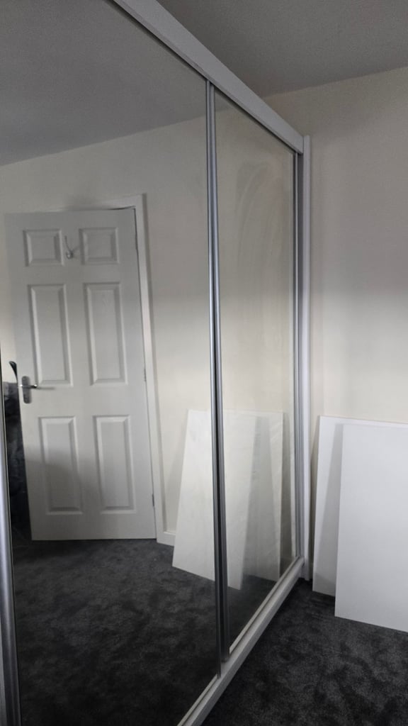 Spacious wardrobe with sliding doors