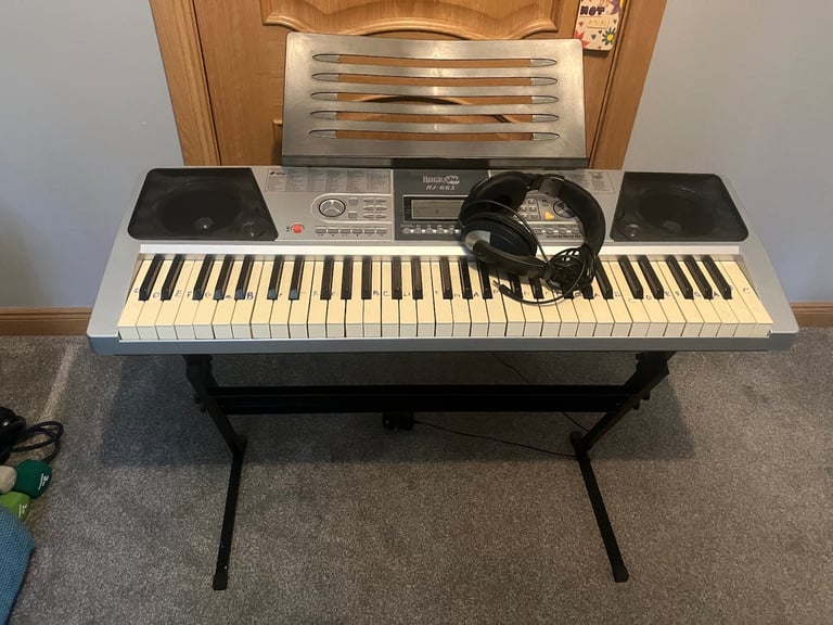 image for Electric keyboard with stand and headphones