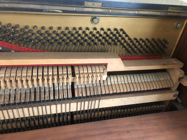 Upright Piano by Stanley Brinsmead London, 7 Octaves, 88 keys, dark wood.  Good condition.