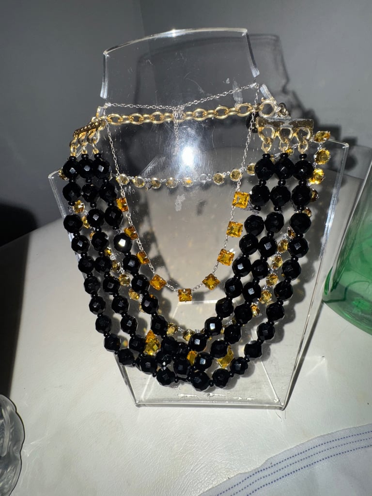 Multi layer black onyx gold tone necklace 