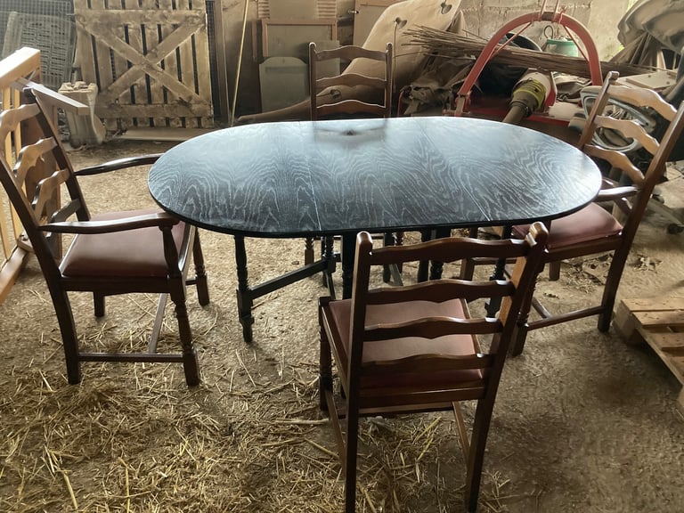 Drop-leaf table and 4 chairs including 2 carver chairs. DE72 area