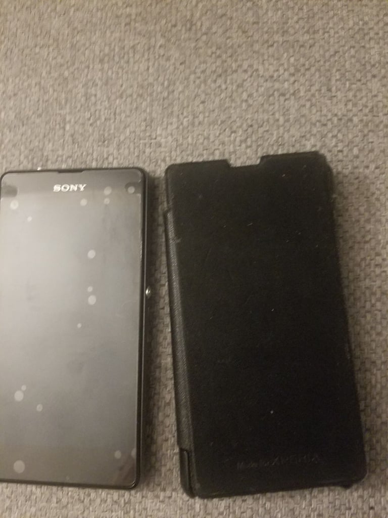 Black sony mobile with charger