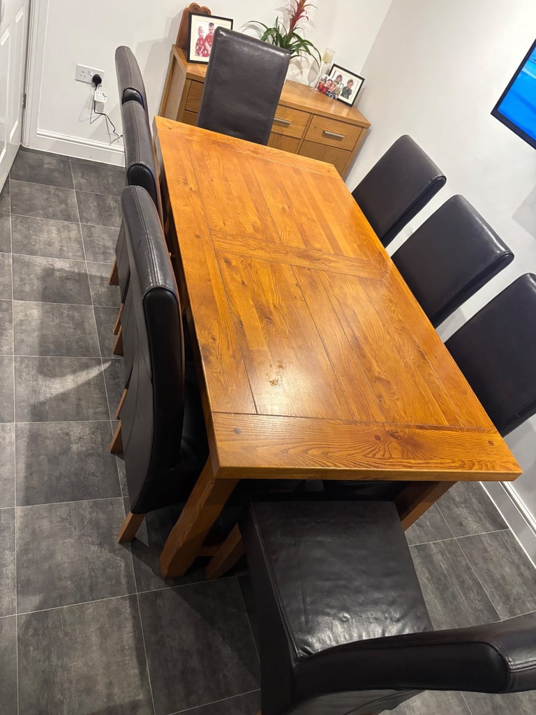 image for Large solid oak table with 8 chairs and 2 leaves 