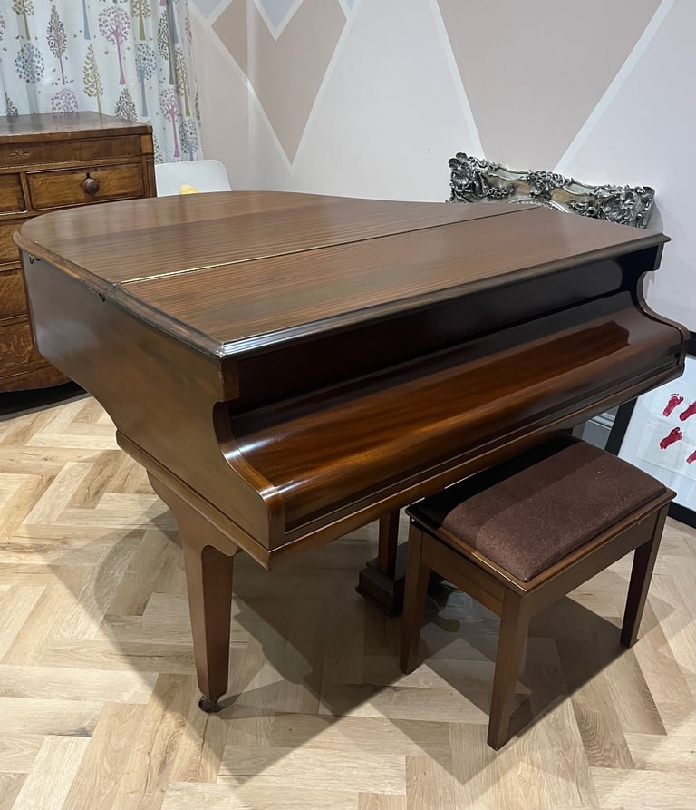 Baby grand piano and stool
