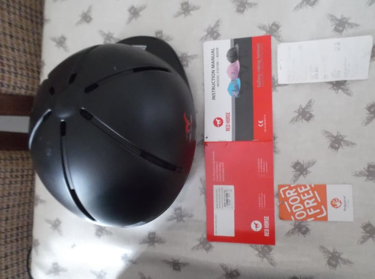 Childs horse riding safety helmet and storage bag