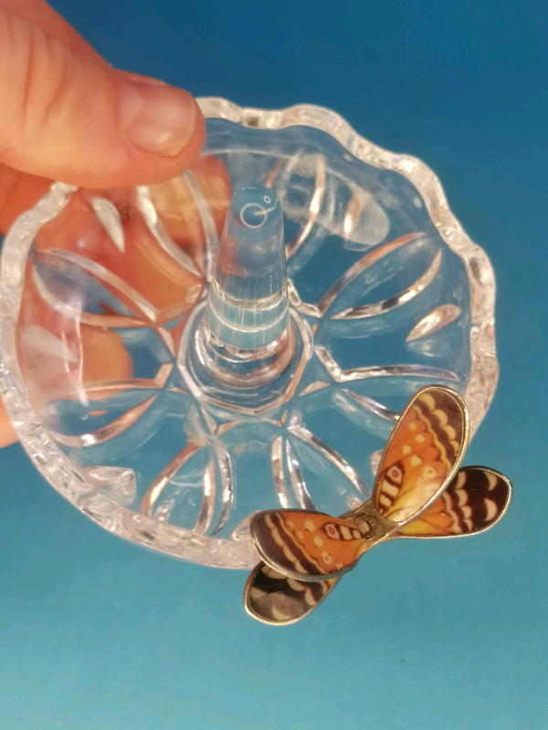 Glass ring holder with butterfly on  a side..