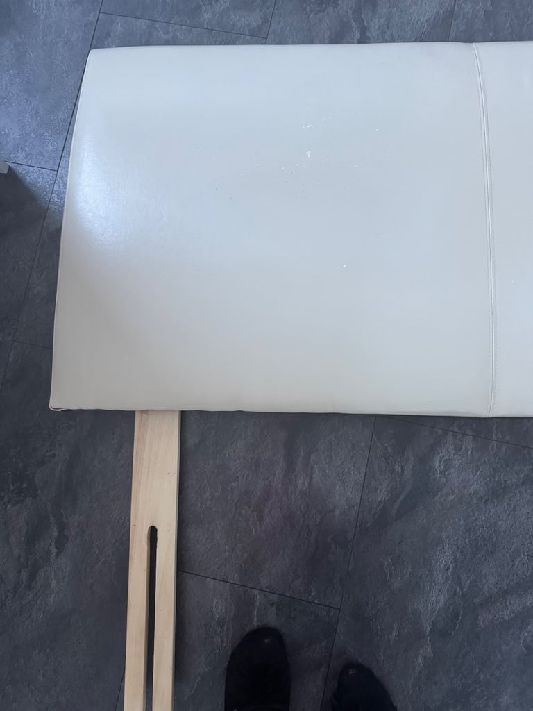 Double cream faux leather headboard. 
