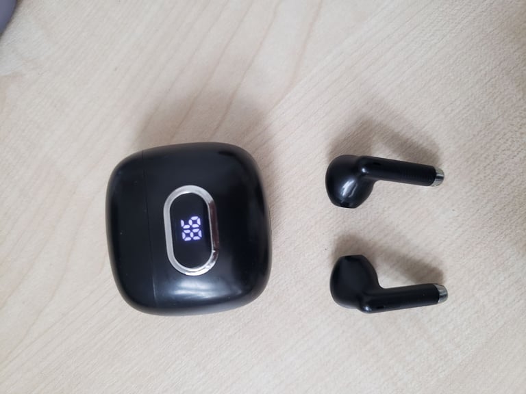 J52 Bluetooth earbuds with a digital display indicating the battery level.