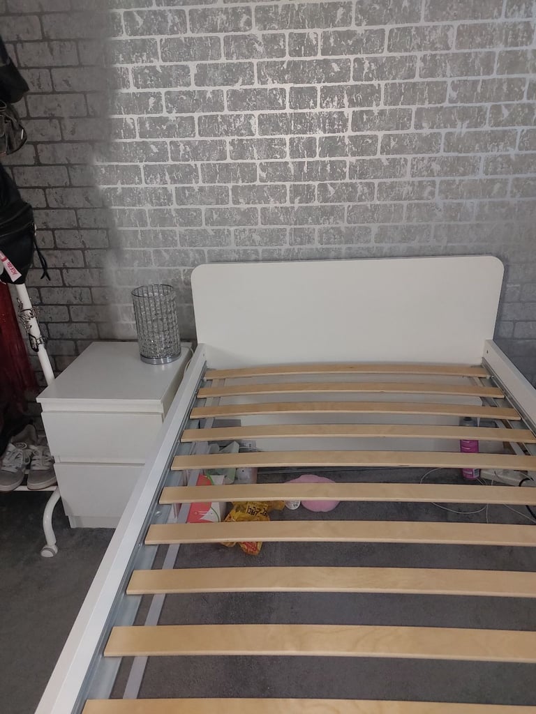 Single bed in white colour with bedside 