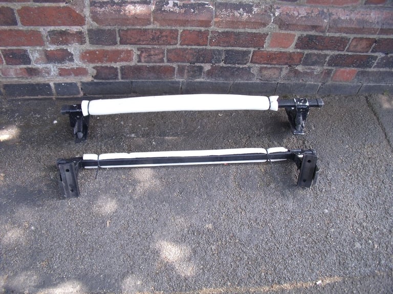 image for A pair of THULE Roof Bars for Small 4 Door Cars