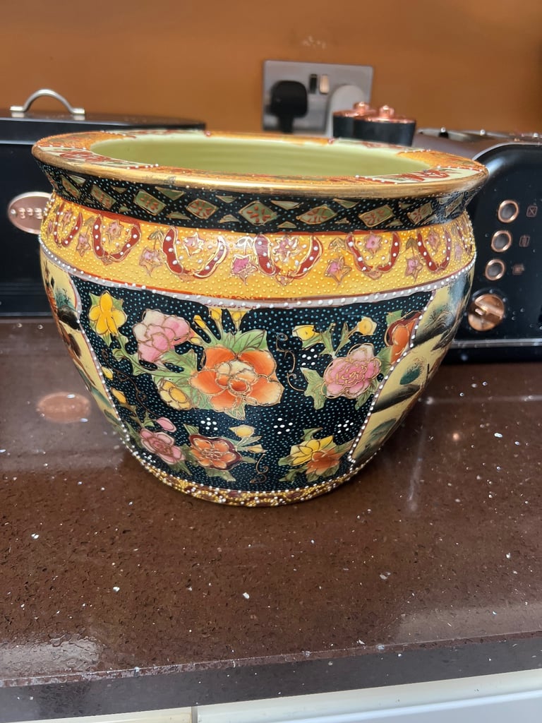 A matching pair of 10 inch diameter Chinese “ goldfish” brand decorative plant