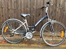 Ammaco Bellini Hybrid Bike with mudguards, kickstand, chainguard, full suspension and bell.