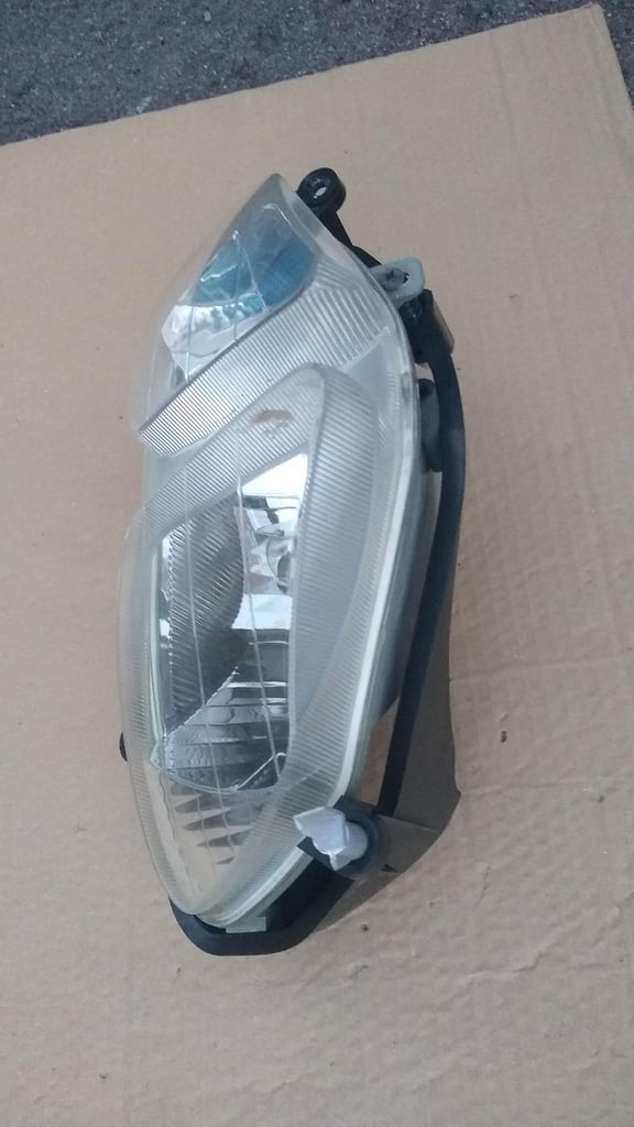 PGO T-Rex moped scooter headlight, new condition.