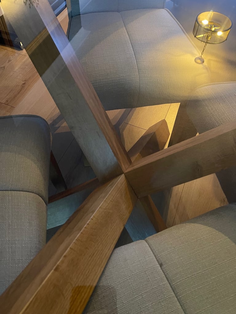 Oak and glass dining table and four chairs