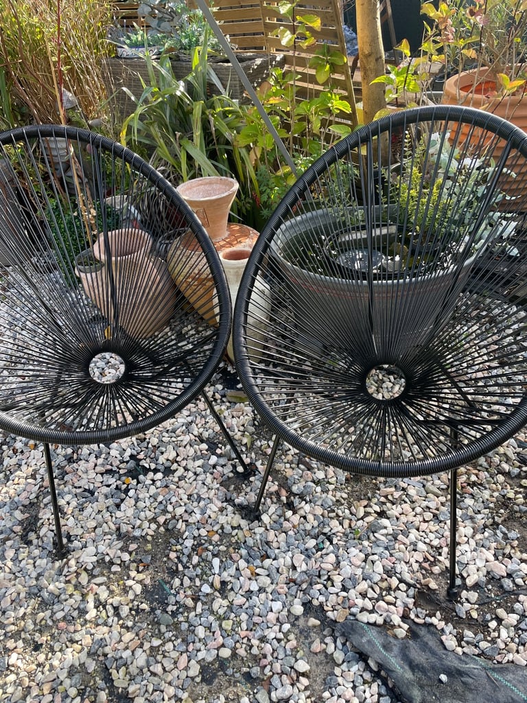 Two Black Rattan Chairs 