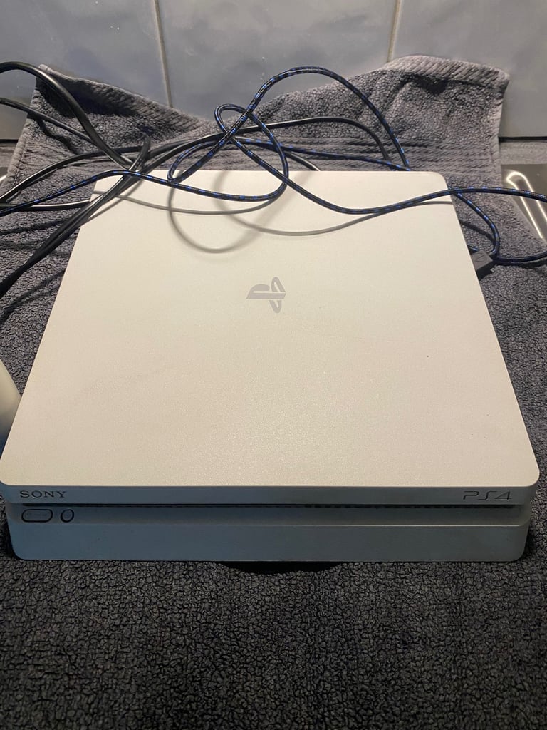 PS4 with 3 games, 1 wireless controller and docking station/charger for controller