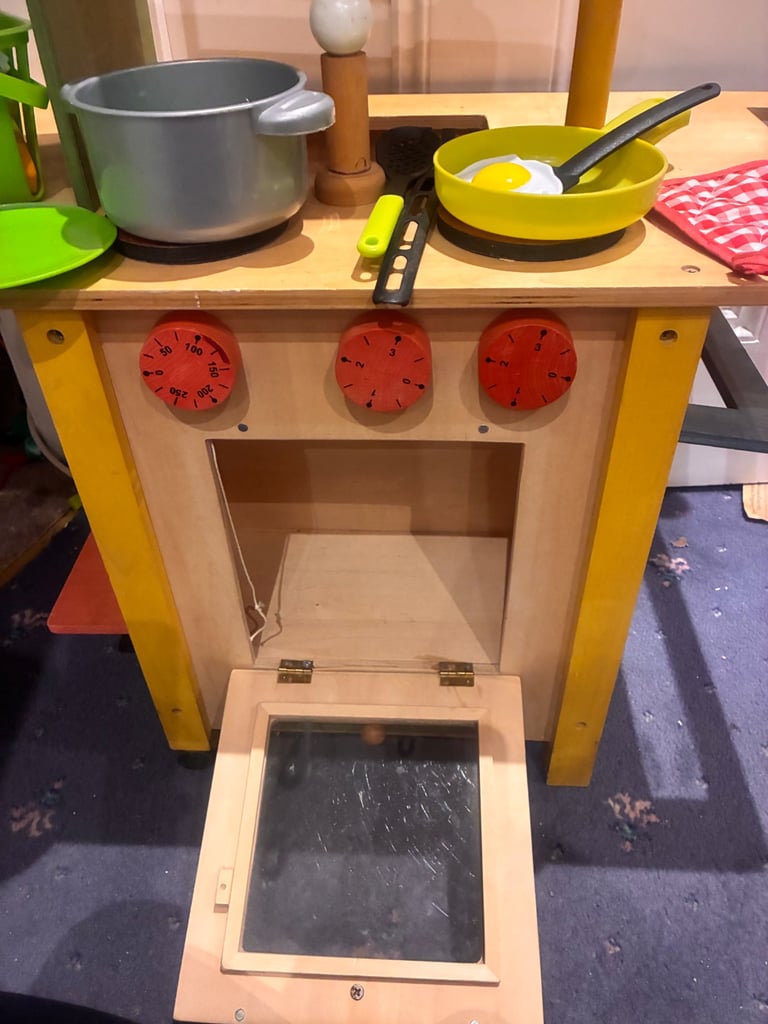 Lovely quality wooden toy play kitchen two sided to include cooker and washing machine used