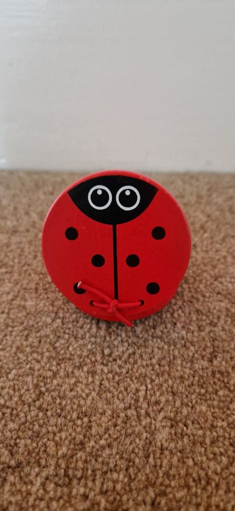 WOODEN CASTANET, LADYBIRD DESIGN. EXCELLENT CONDITION.