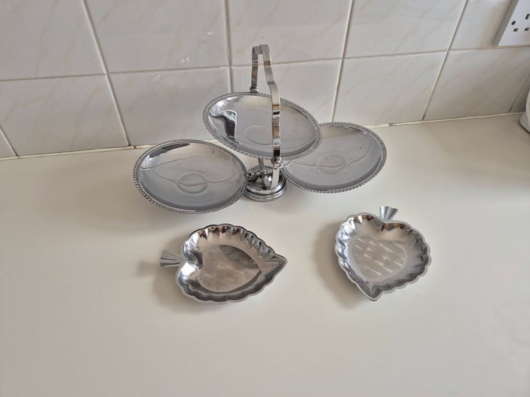 Folding Cake stand, chrome/tin. with 2 leaf shaped serving dishes. £10.00. lincoln