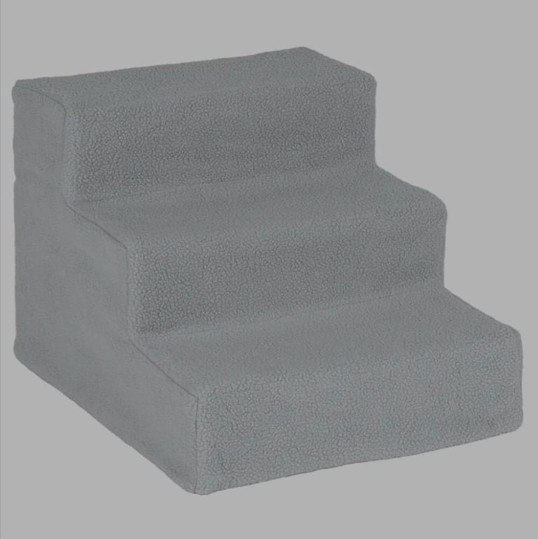 A new already built plastic 3 step pet stairs with grey cover the 