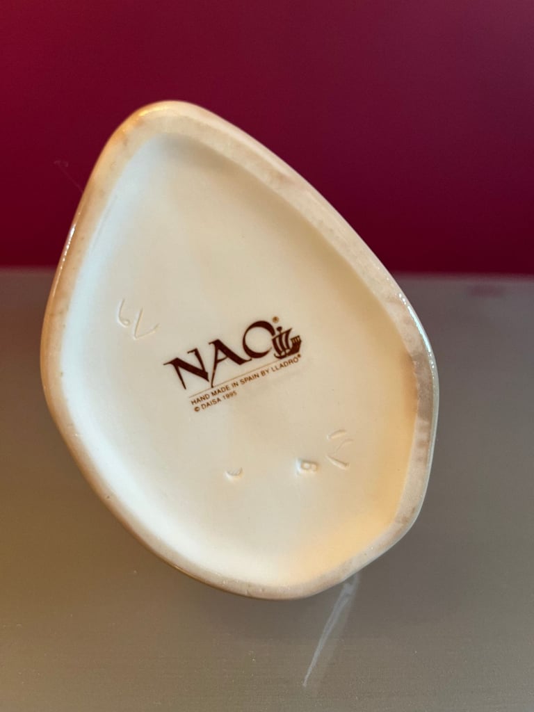 NAO Figurine - Woman, in 1920s outfit, carrying a cat & umbrella