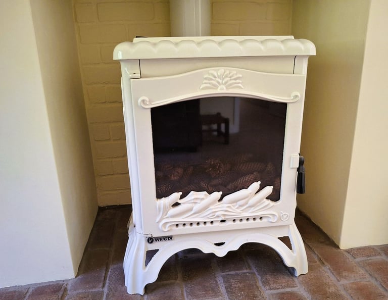 Ivory enamel Invicta French woodburner fire. 