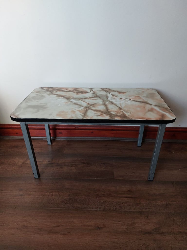 image for Marble top coffee table with strong metal base in good condition.