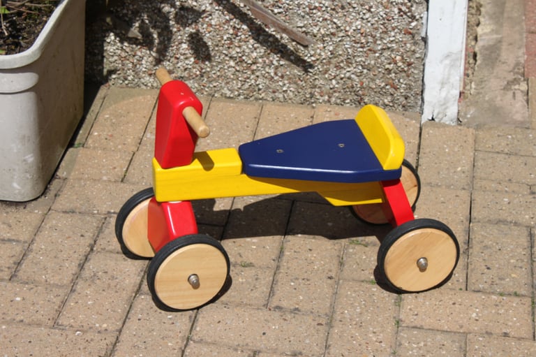 JOHN CRANE WOODEN 4 WHEEL RIDE ON BIKE FOR TODDLERS. GOOD CONDITION. 