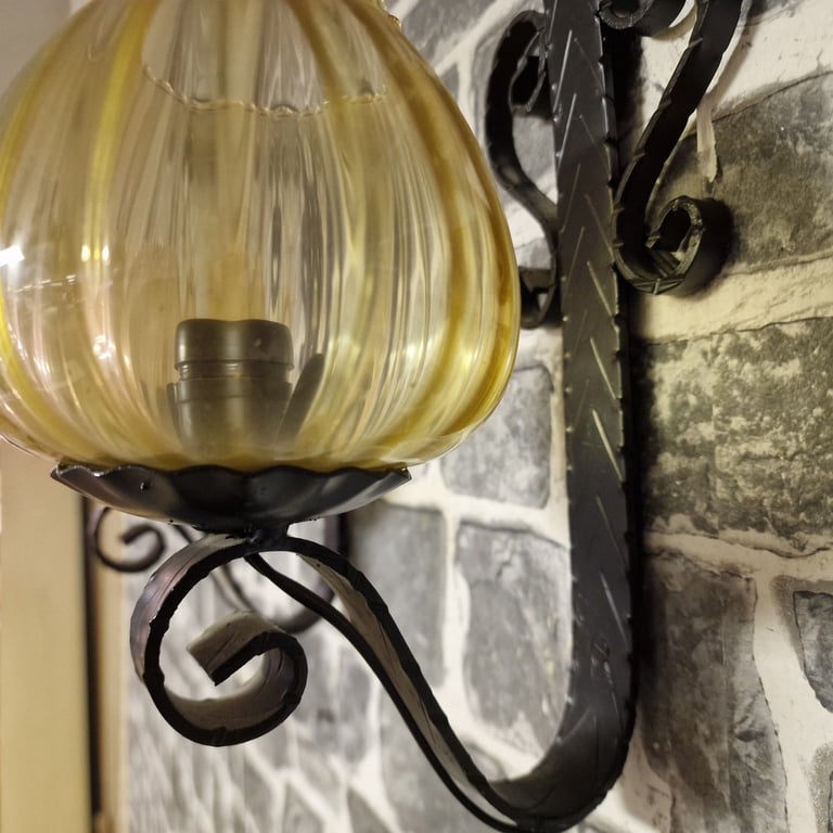 Pair of Vintage Wrought Iron Wall Sconces with Amber Glass Shades