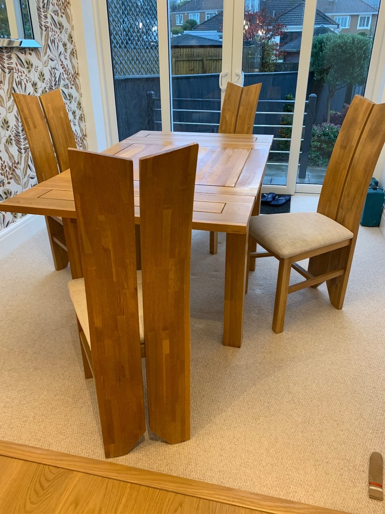 image for Solid oak dining table and chairs