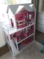 Wooden dolls house with furniture 