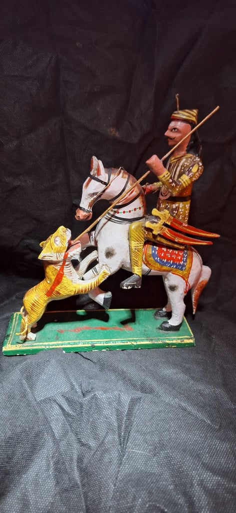 Antique hand carved wooden Indian Mogul hunting a tiger. 