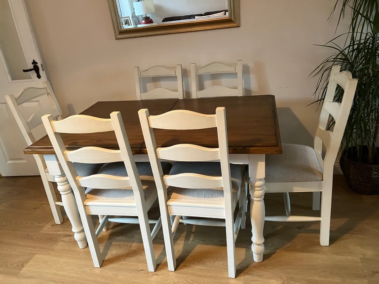image for Dining table and six upholstered chairs.