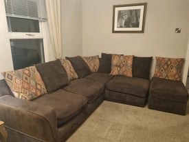 Brown corner sofa with large footstool. 