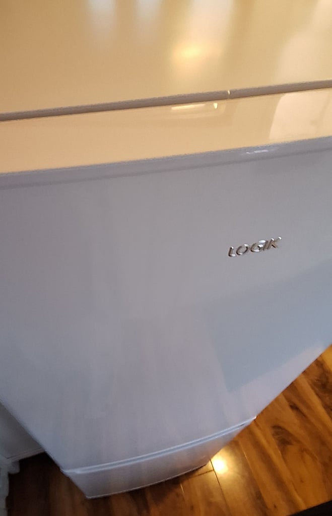 LOGIK fridge freezer size  H 142cm like new one year old 