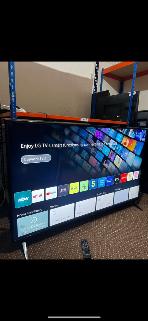 image for Lg 60 inch 4k uhd smart tv with base legs and remote  