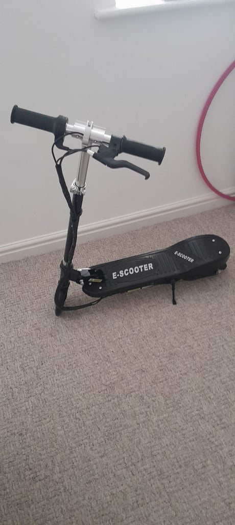 Electric scooter. Black. 7 to 14 years.