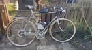 Vintage Raleigh Racer with engine. 