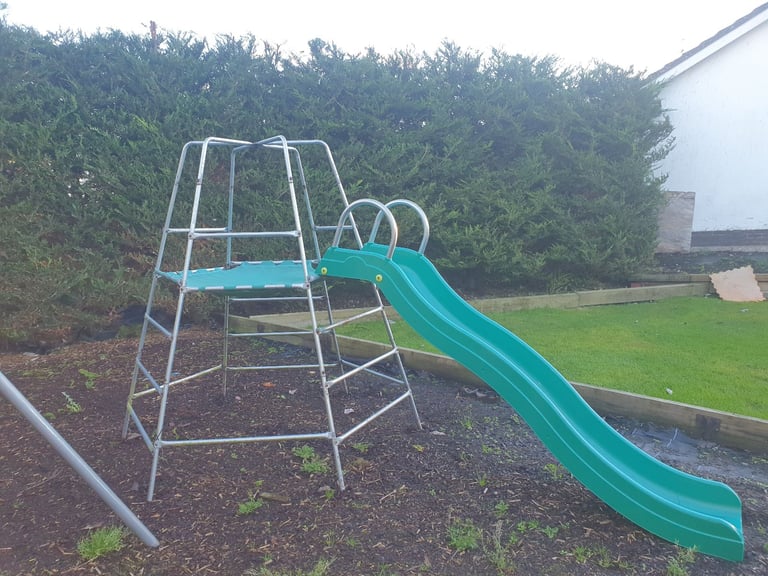 Climbing frame with slide