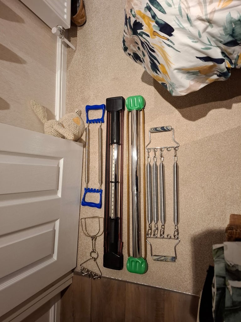 TWO BULLWORKERS and a set of TERRYS CHEST EXPANDERS complete with stirrups.