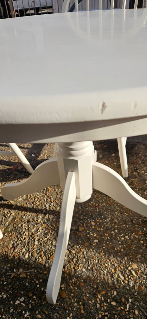 White farmhouse style round table and 4 chairs