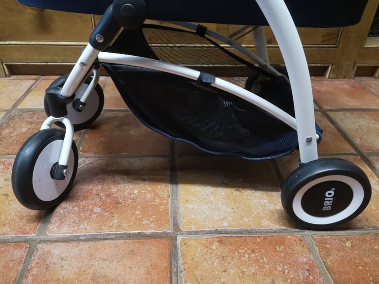 Brio Spin luxury toy pram for dolls & soft toys. Navy blue. Adjustable handle. Great used condition.