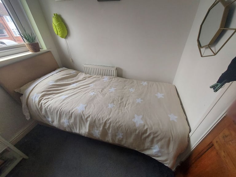 Small single divan bed with mattresses.