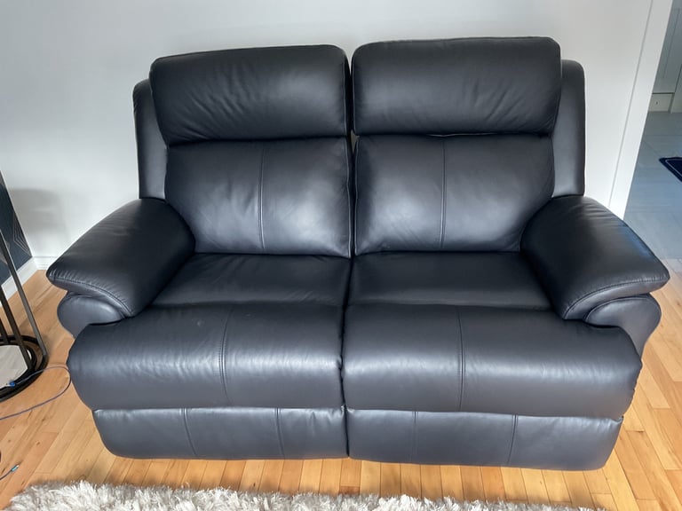 REDUCED PRICE    NEW 2 x 2 seater leather sofas 1 of which is a power recliner
