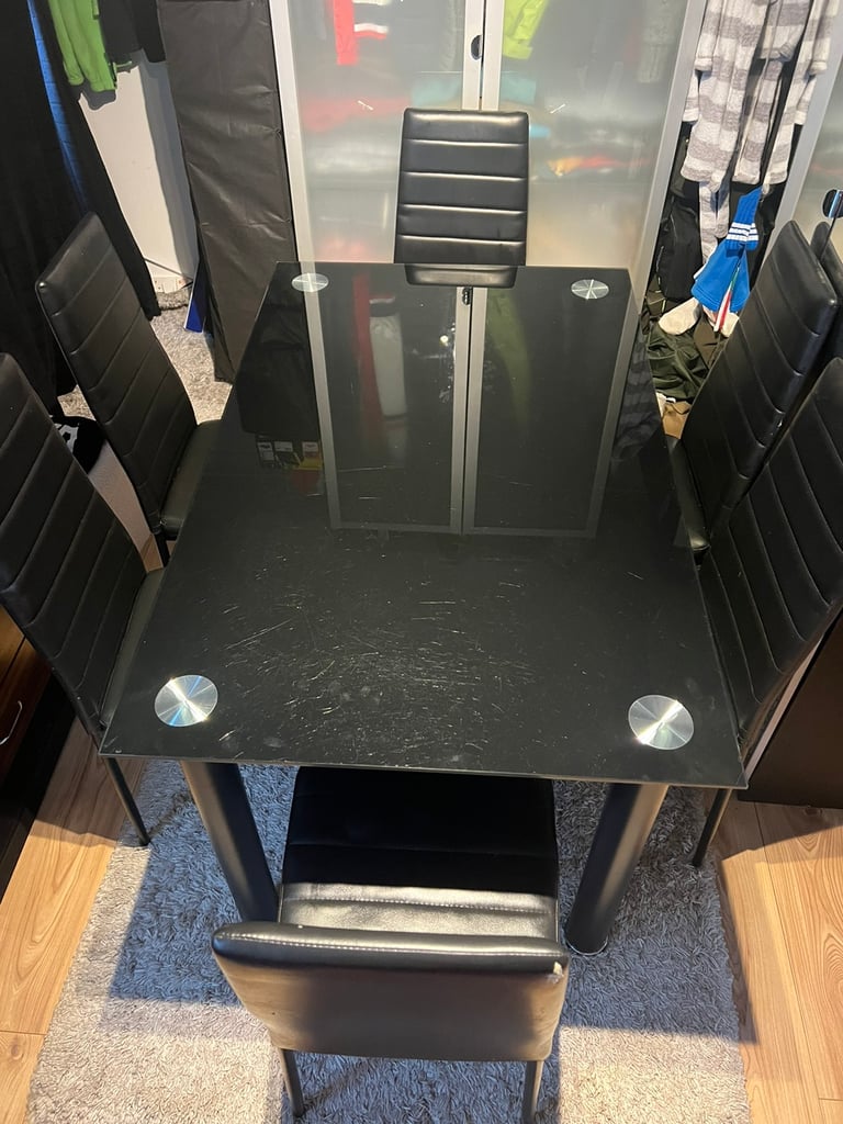 URGENT!!!!Tempered glass black dinning table -6 chairs