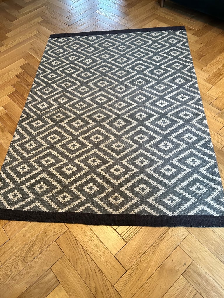 Next grey and white rug