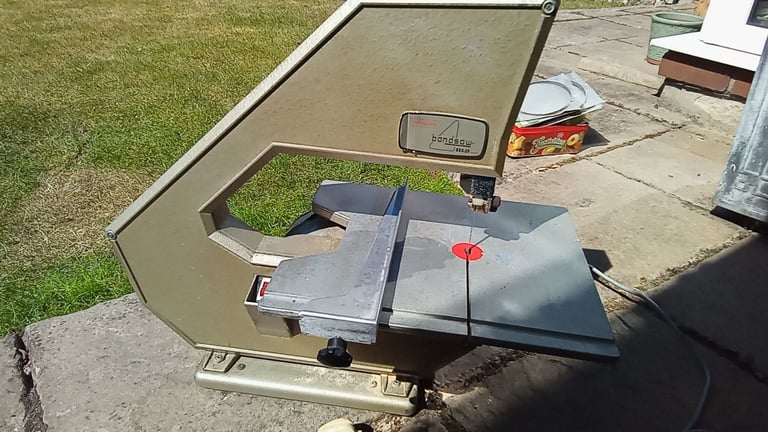 Bandsaw with spare blades.